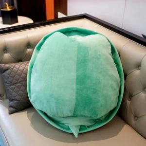 Adorable mint green turtle shell shaped throw pillow for kids sleeping bags, featuring an unusual, funny design in a jumbo size with PP cotton fill. Decorative animals style pillow with a novelty texture and peppermint color scheme.