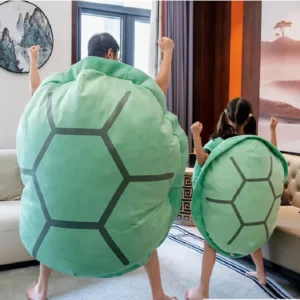 Giant Wearable Turtle Shell Throw Pillows. Adorable mint green turtle shell shaped throw pillow for kids sleeping bags, featuring an unusual, funny design in a jumbo size with PP cotton fill. Decorative animals style pillow with a novelty texture and peppermint color scheme.