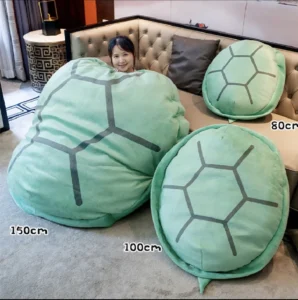 Adorable mint green turtle shell shaped throw pillow for kids sleeping bags, featuring an unusual, funny design in a jumbo size with PP cotton fill. Decorative animals style pillow with a novelty texture and peppermint color scheme.